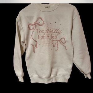 Wound Up Cream Sweater with Pink Design